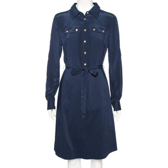 Tory Burch navy dress. Top half is 100% silk. Skirt is double lined w/ bottom l
